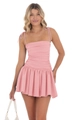 Detail of a pink ruched mini dress with adjustable tie-shoulder straps and pleated hemline - S / Pink
