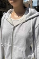 Detail of light gray zip-up hoodie featuring silver metal zipper and soft cotton texture - S / Light Gray