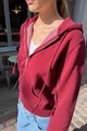 Detail of burgundy zip-up hoodie with drawstring hood and metal zipper in outdoor light - S / Burgundy