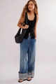 Detail of a navy rib-knit tank top with button closure and high-waisted wide-leg denim jeans - S / Black