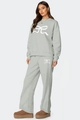 Détail de l'ensemble deux pièces vert-gris clair avec imprimés de nœuds blancs - S / Ensemble Pantalon Col Rond / Gris