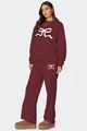 Détail de l'ensemble bordeaux avec imprimés nœuds blancs et pantalon ample décontracté - S / Haut Et Bas / Rouge Foncé