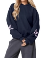 Detail of navy oversized hoodie featuring pink bow prints and drop shoulder sleeves - S / Dark Blue