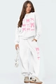 Détail de l'ensemble blanc avec imprimés nœuds roses et ourlet élastique du jogging - S / Haut Et Bas / Blanc