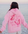 Close-up of pink hoodie back featuring embroidered butterflies and artistic text - S / Pink