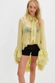 Close-up of light green sheer chiffon blouse featuring delicate ruffles and bow tie - S / Yellow-Green