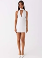 Detail of white halter neck mini dress with deep V-neckline and satin finish texture - S / White