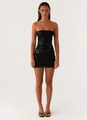 Detailed close-up of intricate black floral sequin embroidery on a strapless mini dress - Black