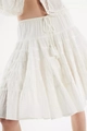 Detail of white tiered skirt with elastic smocked waist and boho tassel drawstrings - S / White