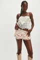 Detail of layered ruffle mini skirt with floral print and white lace camisole top - S / Bottoms / Pink