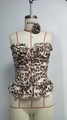 Detail of leopard print tube top featuring front buttons and tiered ruffle hemline - S / Leopard Print