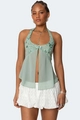 Close-up of light green sequined halter top with intricate floral embroidery and front slit - Green