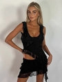 Dettaglio completo di set due pezzi in chiffon nero con volant e gonna asimmetrica - Taglia S / Top e Bottom / Nero