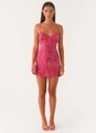 Close-up of intricate sequin floral embroidery and beaded texture on pink mini dress - Rose Red