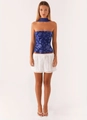 Close-up of blue sequin floral embroidery on a satin corset top and white eyelet skirt - S / Top And Bottom / Navy Blue