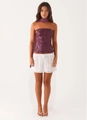 Detailed embroidery on purple sequin tube top paired with white eyelet mini skirt - S / Top And Bottom / Crimson