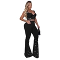Detail of silver metal eyelets on black crop top and high-waisted flare trousers set - S / Black