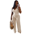 Two-piece cream white set featuring halter V-neck top and pleated wide-leg trousers - S / Apricot