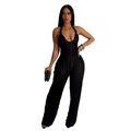 Close-up of black backless halter jumpsuit featuring sheer striped texture and deep V-neck - S / Black