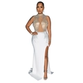 Detailed view of white evening dress featuring mesh patchwork and sparkling rhinestones - S / White