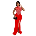 Detailed view of red evening dress featuring rhinestone embellishments and high leg slit - Red