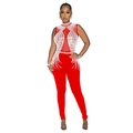 Detail of red sleeveless jumpsuit featuring rhinestone patterns and sheer mesh insert - S / Red