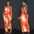 Elegant backless halter maxi dress with vibrant orange floral print and high side slit - Orange