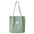 Light green corduroy tote bag featuring a decorative graphic patch and metal snap buttons - Bean Green
