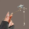 Gold metal hair stick with blue magnolia flower and long pearl tassel details - Lily