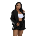 Detail of black sports set featuring white triple stripes on jacket sleeves and shorts - S / Black