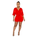 Detail view of red V-neck romper featuring a stylish waist tie and premium glossy fabric - S / Red