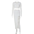 Women's white two-piece knit set featuring long sleeve cropped cardigan and high slit maxi skirt - S / White