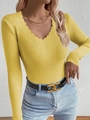Detail of scalloped V-neckline on yellow ribbed knit long sleeve sweater for women - Yellow