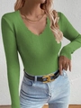 Detail of green V-neck ribbed knit sweater with unique wavy neckline and slim fit design - Fruit Green