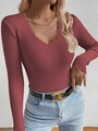 Close-up of dark red slim fit V-neck knit sweater with scalloped edge detail - Brick Red