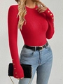 Detail of red ribbed knit sweater featuring decorative gold buttons on the long sleeves - Red
