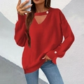 Detail of red V-neck knit sweater featuring a choker cutout and elegant pearl buttons - Red