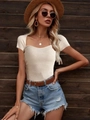 Close-up of cream square-neck ribbed knit top styled with summer vacation accessories - XS / Apricot