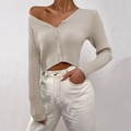 Detail view of beige ribbed knit texture and button closure on women's V-neck cardigan - S / Khaki