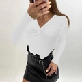 Detail of white rib-knit sweater featuring a deep V-neck and twist knot design on the chest - S / White