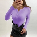 Detail of ribbed knit texture on long sleeve V-neck sweater with button placket - Purple