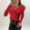 Detail of red ribbed knit sweater featuring a stylish twist-knot V-neckline design - Red