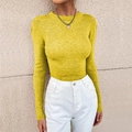 Close-up of mustard yellow slim fit ribbed knit sweater featuring a classic round neck - Yellow