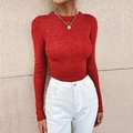 Close-up of a red ribbed knit sweater featuring a classic crew neck and slim fit design - Red