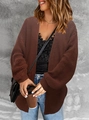 Close-up of chunky knit texture and lantern sleeve detail on dark brown cardigan - Coffee