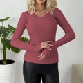 Detail of ribbed knit texture on a dusty rose V-neck sweater with long sleeves - Brick Red