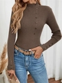 Detailed close-up of brown ribbed knit sweater featuring decorative buttons on the cuffs - Coffee