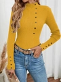 Detailed view of yellow ribbed knit sweater with decorative buttons on collar and cuffs - Yellow