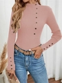 Detailed close-up of ribbed texture and elegant shoulder buttons on pink sweater - Pink