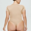 Rear view of tight apricot bodysuit showing high elastic knit fabric and slim fit style - 3XL / Top (Short Sleeve Square Neck) / Apricot